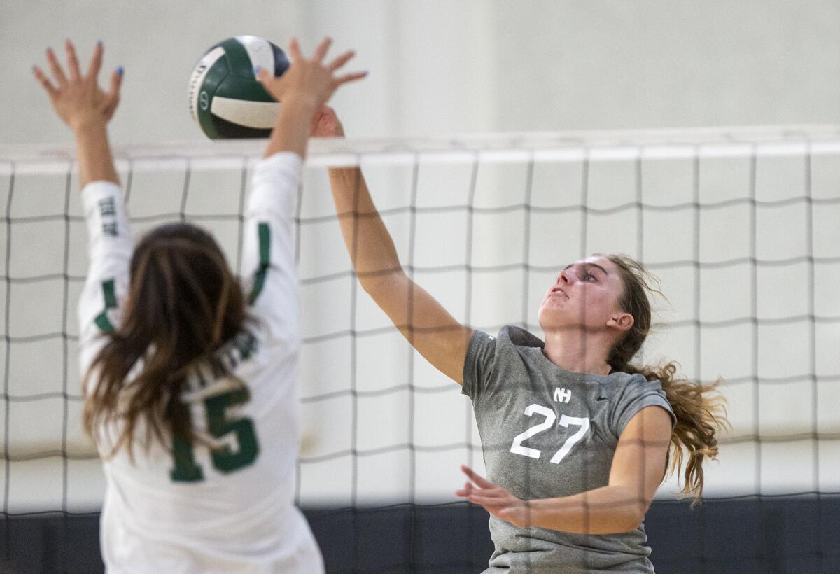 Newport Harbor's Emma Fults hits against Sage Hill's Eva Alexander.