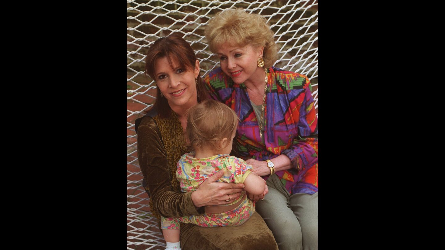 Three generations: Carrie Fisher, with her mother, Debbie Reynolds, and daughter, Billie Lourd, in 1994.