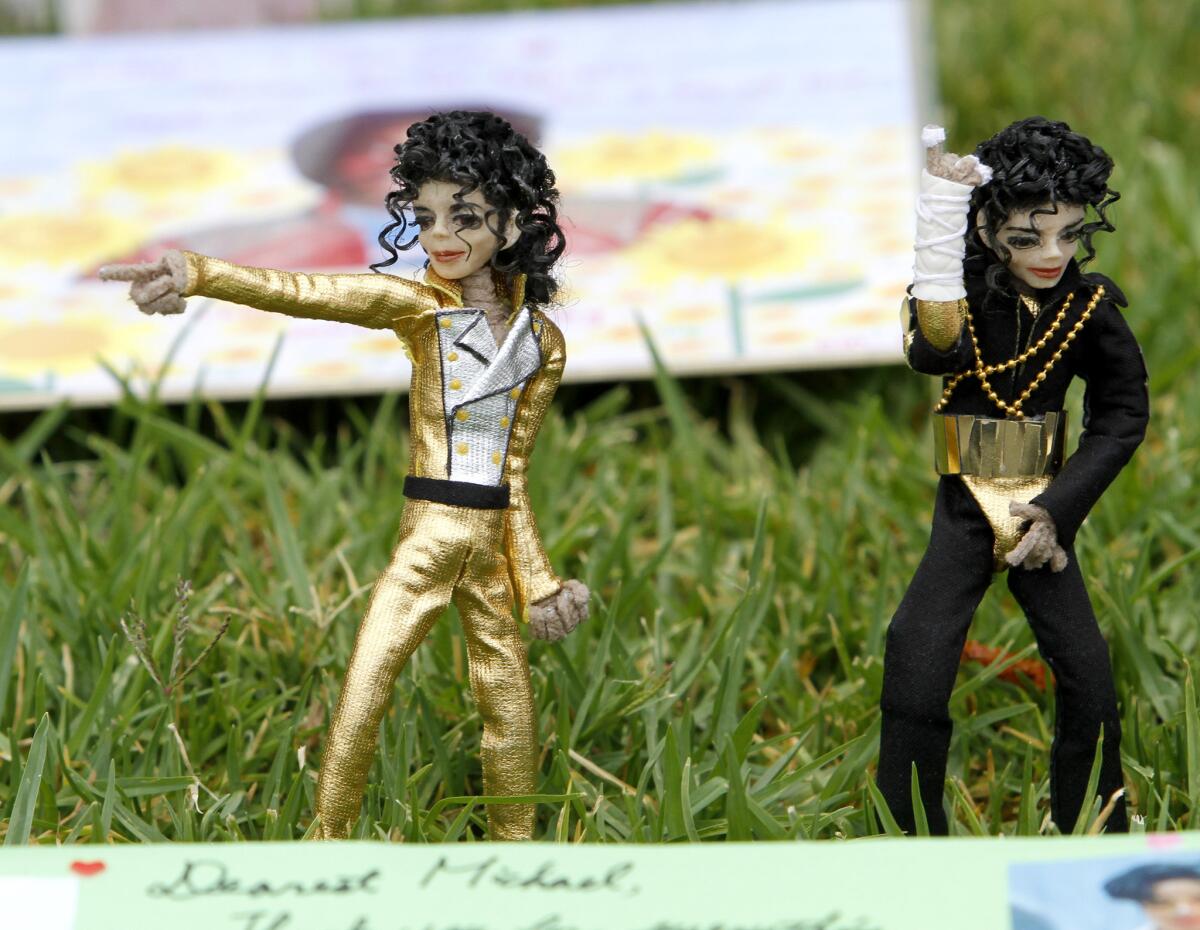 A couple of Michael Jackson dolls left at the Michael Jackson fan memorial on the 5th anniversary of Jackson's death, at Forest Lawn Memorial Park in Glendale on Wednesday, June 25, 2014. Jackson is buried at the Great Mausoleum at Forest Lawn.