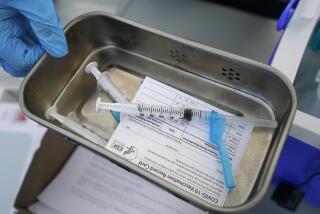 Syringes filled with Johnson & Johnson's COVID-19 vaccine in a tray at a mobile vaccination site in Miami. 