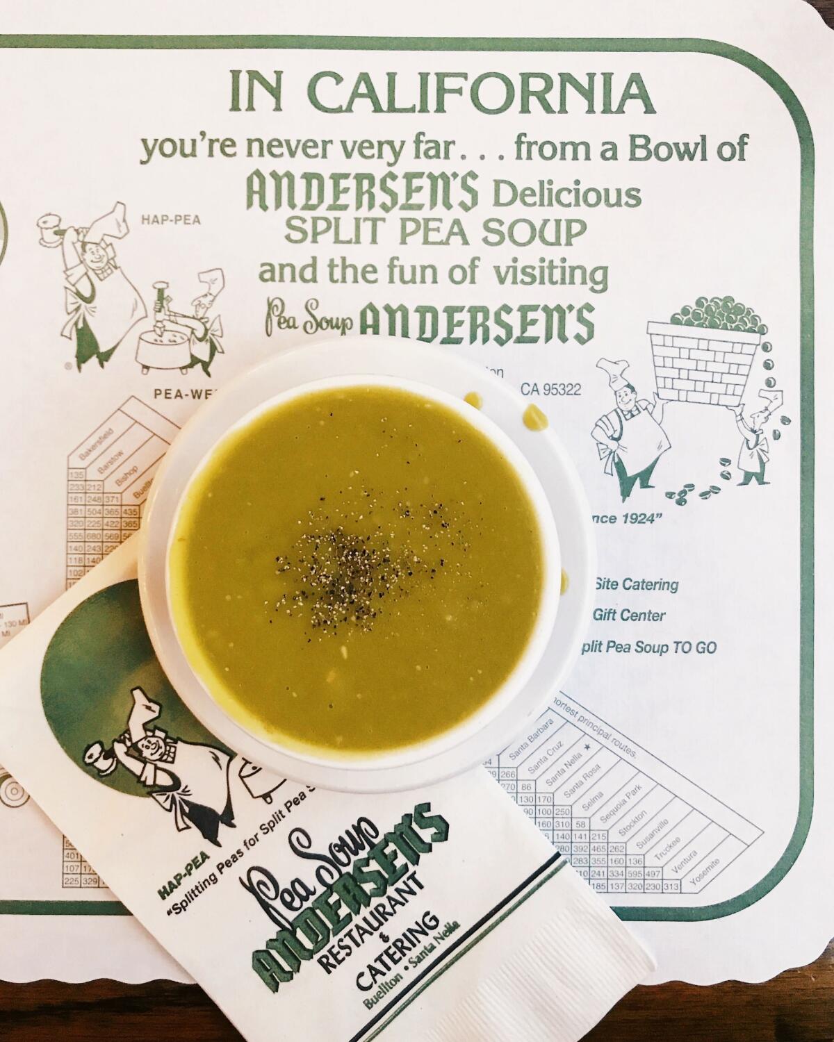 An overhead of a bowl of pea soup on branded paper placemat at the Buellton location of Pea Soup Andersen's.