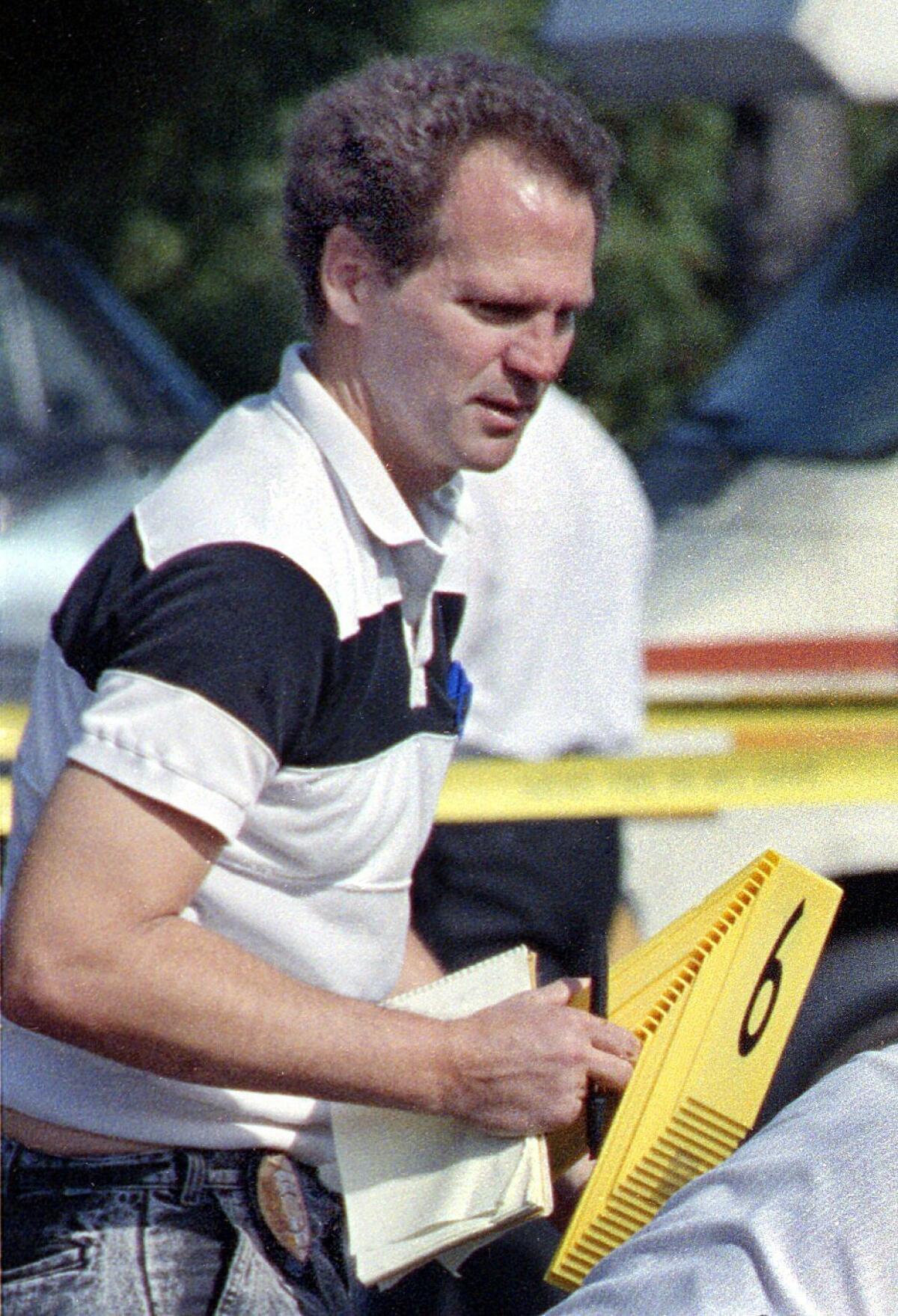 SDPD criminalist Kevin Brown works at a crime scene in 1991. Brown, who worked for 20 years in the San Diego Police Department's laboratory, apparently committed suicide as police were making preparations to arrest him in the 1984 murder of 14-year-old Claire Hough. — Howard Lipin / U-T San Diego