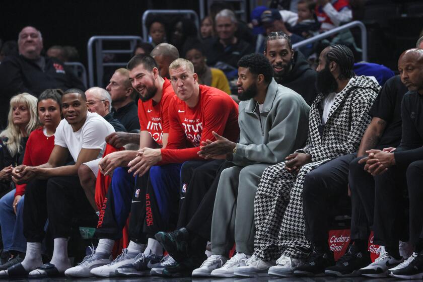 Los Angeles, CA, Sunday, April 14, 2024 - Clippers starters including Paul George, James Harden and Kawhi Leonard sit on the bench in street clothes during a game against the Houston Rockets at Crypto.Com Arena. (Robert Gauthier/Los Angeles Times)