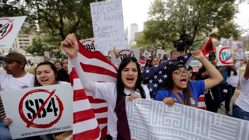 Protesters march in Austin, Texas, in February to support immigrant rights and sanctuary cities, and rally against a border wall.