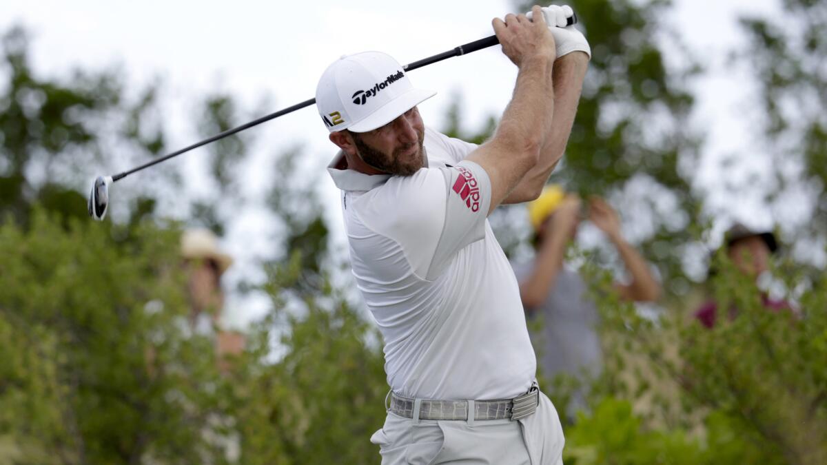 Dustin Johnson hits from the first tee during the second round of the Hero World Challenge on Friday.