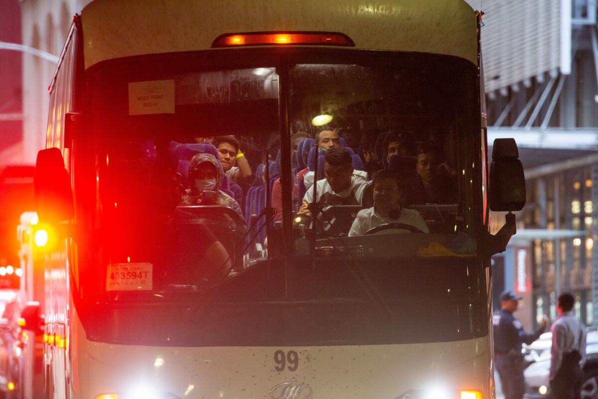 A migrant bus arrives at the Port Authority bus terminal.