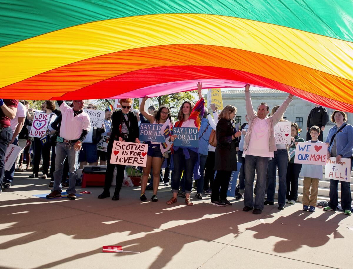 Pro and anti-gay marriage demonstrators rallied outside the U.S. Supreme Court as it heard arguments on same-sex marriage Tuesday.