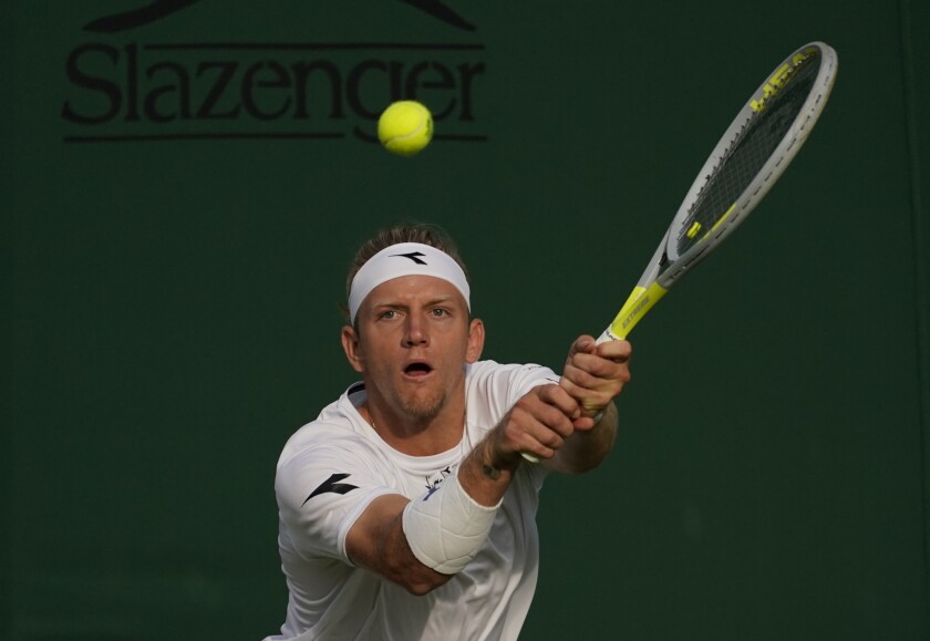 Spain's Alejandro Davidovich Fokina plays a return to Jiri Vesely of the Czech Republic in a second round men's singles match on day three of the Wimbledon tennis championships in London, Wednesday June 29, 2022. (AP Photo/Alberto Pezzali)