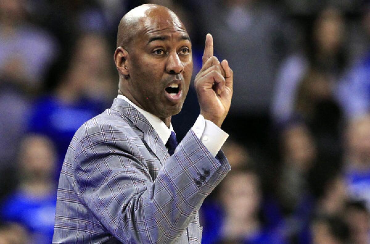 Danny Manning gives instructions to his Tulsa players during a game against Creighton.