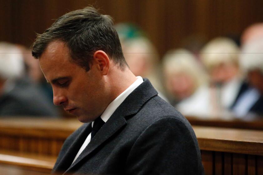 Oscar Pistorius listens during the sentencing hearing in his murder trial at the High Court in Pretoria on July 6.