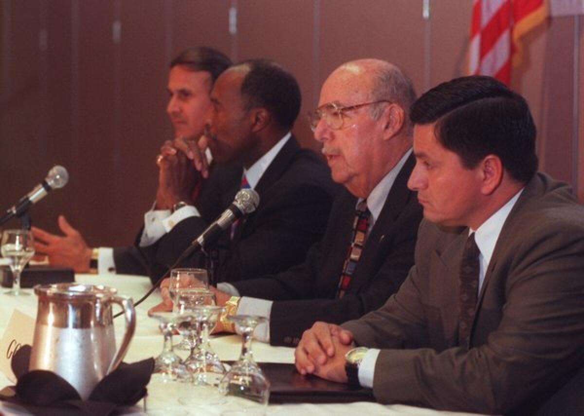 Then-Sheriff Sherman Block speaks at a 1998 political forum. Patrick Gomez, right, announced this week that he will challenge incumbent Sheriff Lee Baca, left, in 2014.