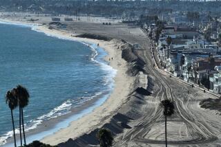 Long Beach, CA - August 18: A sand berm is built up along the shore of Long Beach near Alamitos Bay ahead of anticipated high surf, strong winds and flooding from the approaching Hurricane Hilary in Long Beach Friday, Aug. 18, 2023.Long Beach, an area ravaged by the last tropical storm to hit California in 1939, is urging residents in low-lying areas to protect their property with sandbags. As Hurricane Hilary continues its march toward Southern California, officials have issued an unprecedented tropical storm watch for the region. The watch is in effect for much of southwestern California, from the San Diego deserts to the San Bernardino County mountains and onto Catalina Island, something the National Hurricane Center said is a first for this area. A tropical storm watch indicates that tropical storm conditions are possible - meaning more than 39 mph sustained winds - within 48 hours, according to the hurricane center. (Allen J. Schaben / Los Angeles Times)