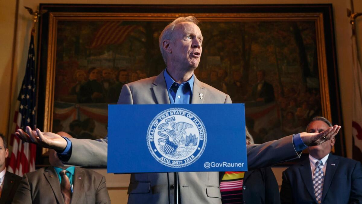 Illinois Gov. Bruce Rauner, shown in a file photo, argued that the minimum wage bill would hurt businesses and reduce jobs.