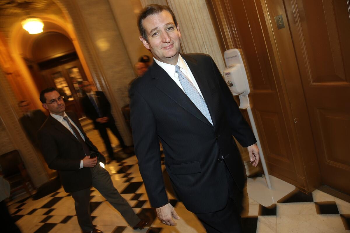 Sen. Ted Cruz (R-Texas) leaves the chamber on Dec. 13 after the Senate voted to approve a $1.1-trillion spending bill despite his objections to President Obama's immigration policy.