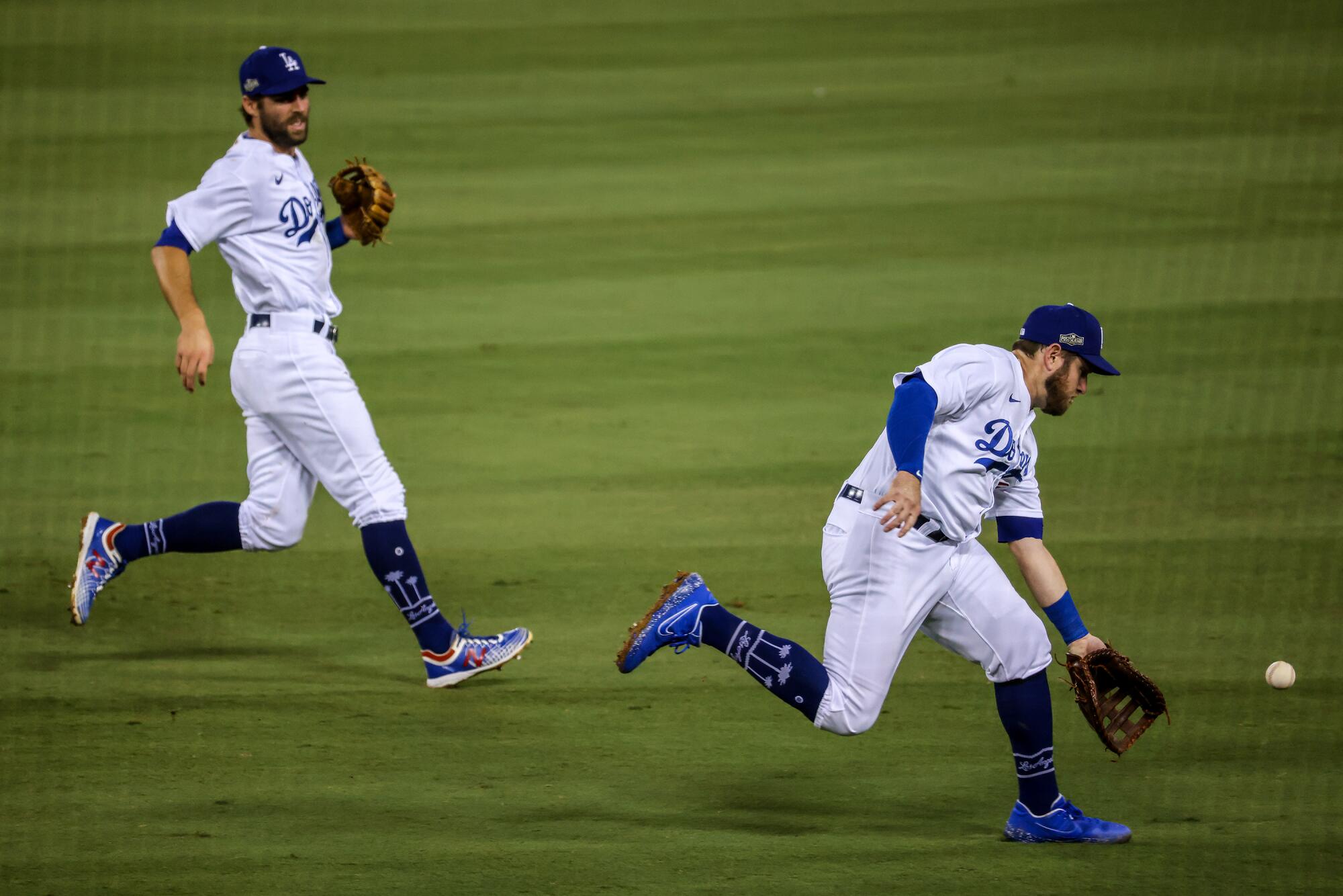 Dodgers second baseman Max Muncy commits an error on a sixth inning pop single by the Brewers' Avisail Garcia.