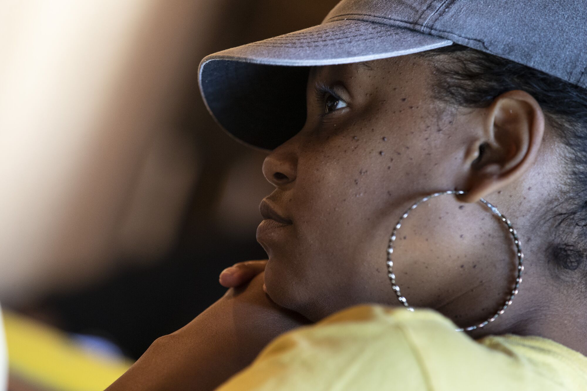 Melissa Phillips listens as women talk about the challenges of caring for a family member