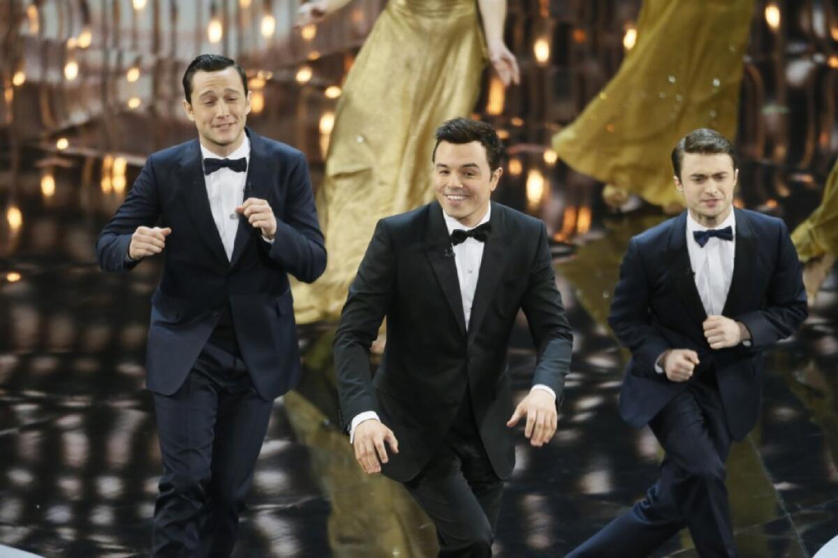 Joseph Gordon-Levitt, left, Seth MacFarlane and Daniel Radcliffe perform during the 85th Academy Awards.