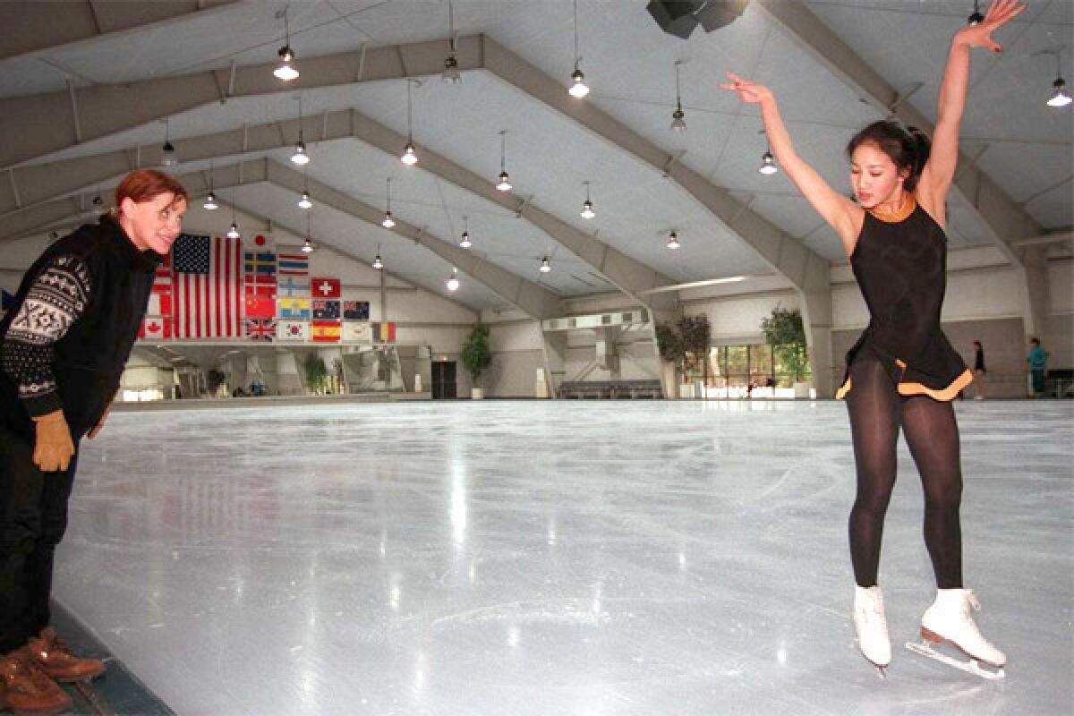 Michelle Kwan works on her choreography with Elena Tcherkasskaia at Ice Castle International Training Center in Lake Arrowhead, Calif. on March 11, 1996.