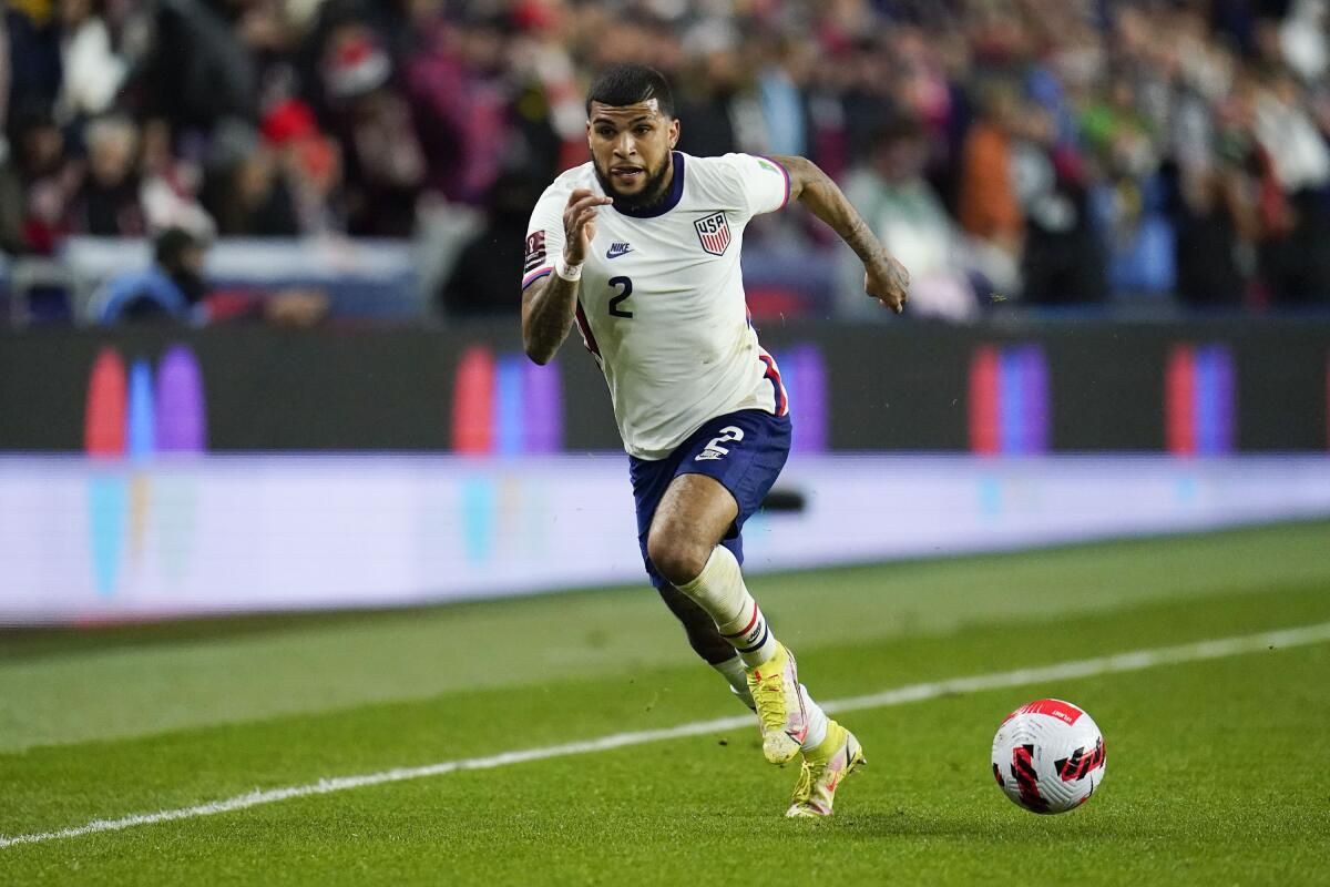 FILE - United States' DeAndre Yedlin plays during the first half of a FIFA World Cup qualifying soccer match against Mexico, Friday, Nov. 12, 2021, in Cincinnati. Yedlin is returning to Major League Soccer, agreeing Wednesday, Feb. 2, 2022, to a four-year contract with David Beckham’s Miami team. (AP Photo/Julio Cortez, File)