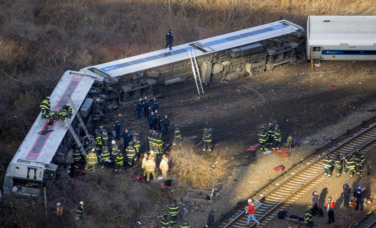 First responders work the scene of a derailment of a Metro-North passenger train in the Bronx borough of New York on Sunday.