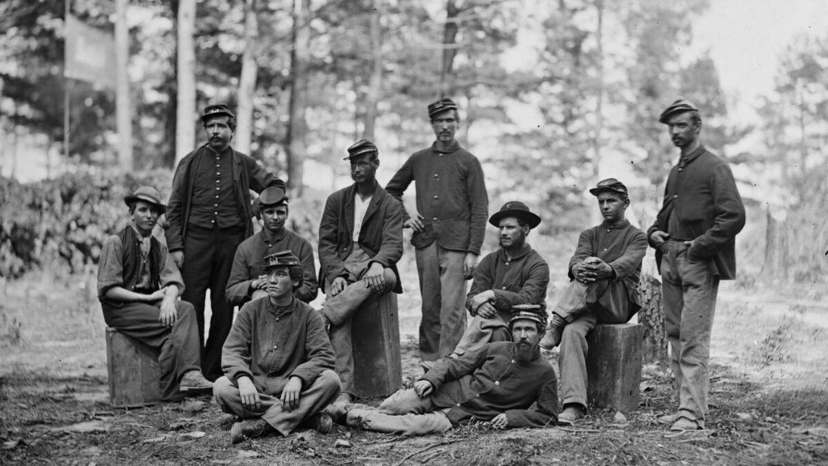 Union soldiers pose during the Siege of Petersburg in Virginia in 1864. A new study of the descendants of Union soldiers shows how the effects of trauma are passed down from generation to generation.