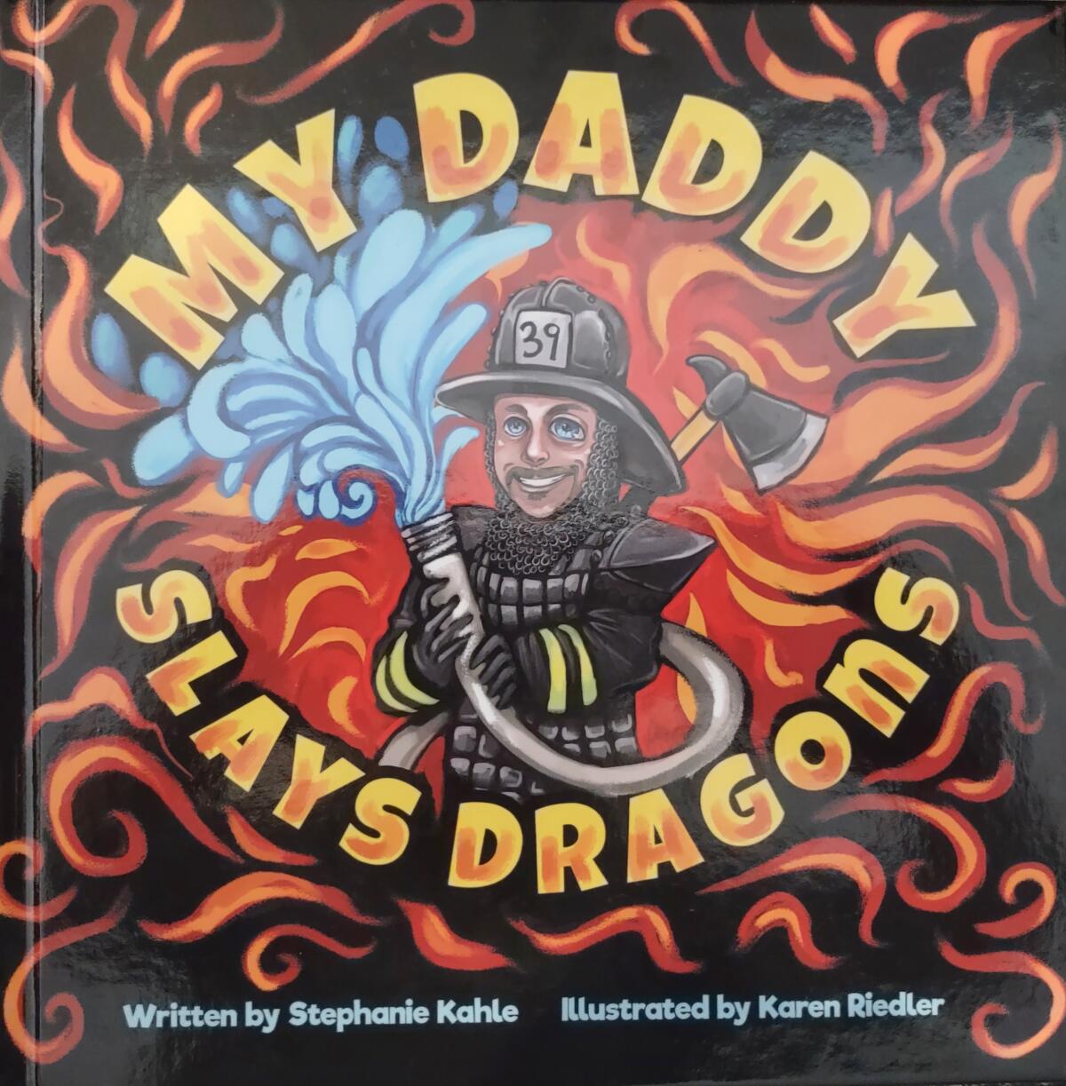 “My Daddy Slays Dragons” explains to Stephanie Kahle’s son, Tehren, why his dad, Ehren, was away from home fighting fires.