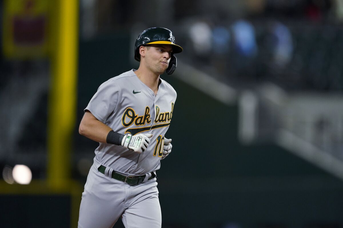 Oakland Athletics' Chad Pinder runs the bases after hitting a grand slam in the 12th inning of the team's baseball game against the Texas Rangers, Tuesday, July 12, 2022, in Arlington, Texas. (AP Photo/Tony Gutierrez)