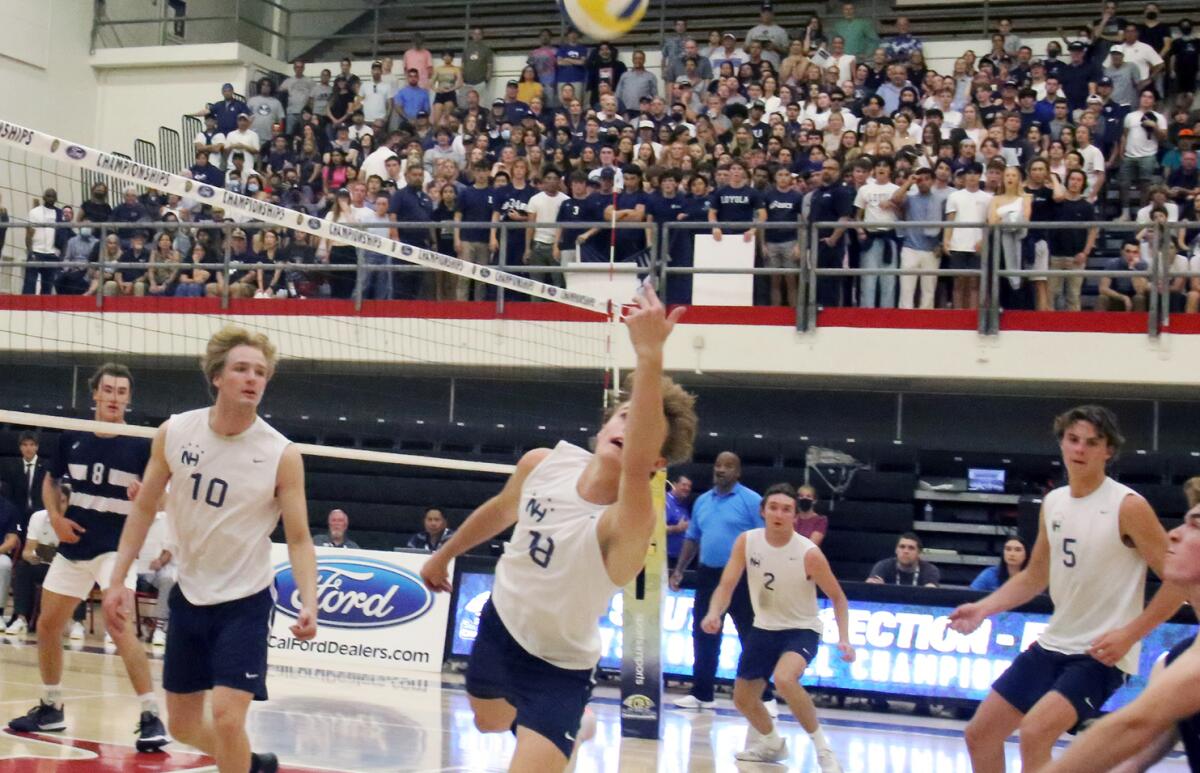 Newport Harbor's Luca Curci (18) dives to keep the ball in play during the Division 1 boys' volleyball final Saturday.