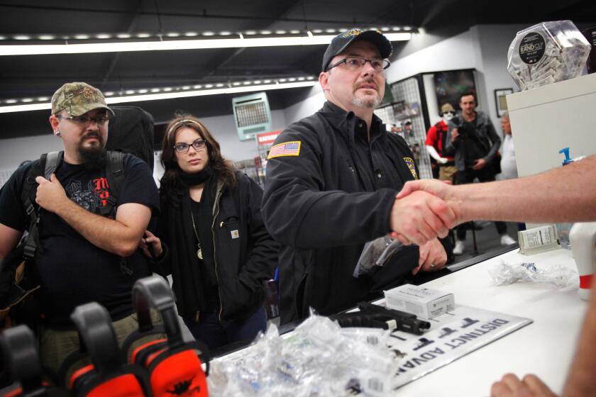 Assemblyman Tim Donnelly, a Republican candidate for governor, is losing his campaign manager, Jennifer Kerns, shortly before his party's convention. Donnelly, an outspoken gun rights advocate, is pictured here shaking hands at a Santa Cruz County gun range in February.