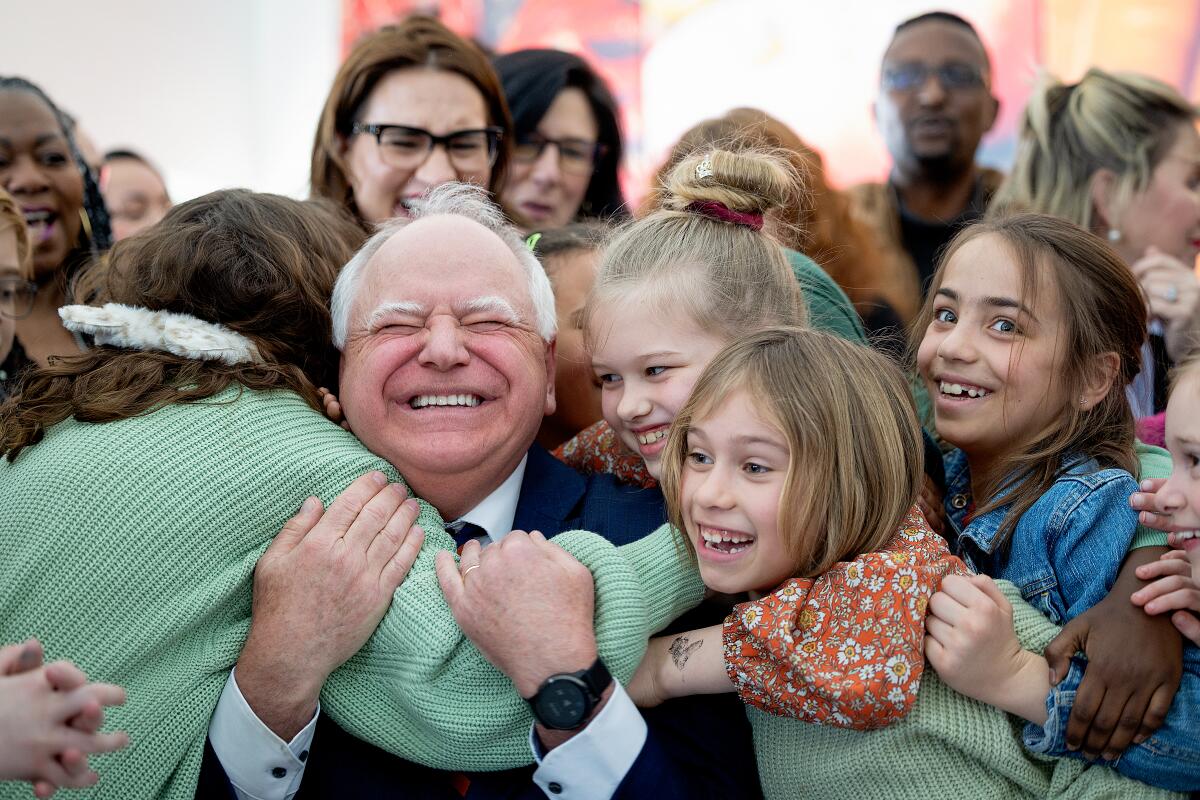 Minnesota Gov. Tim Walz gets a hug from students 