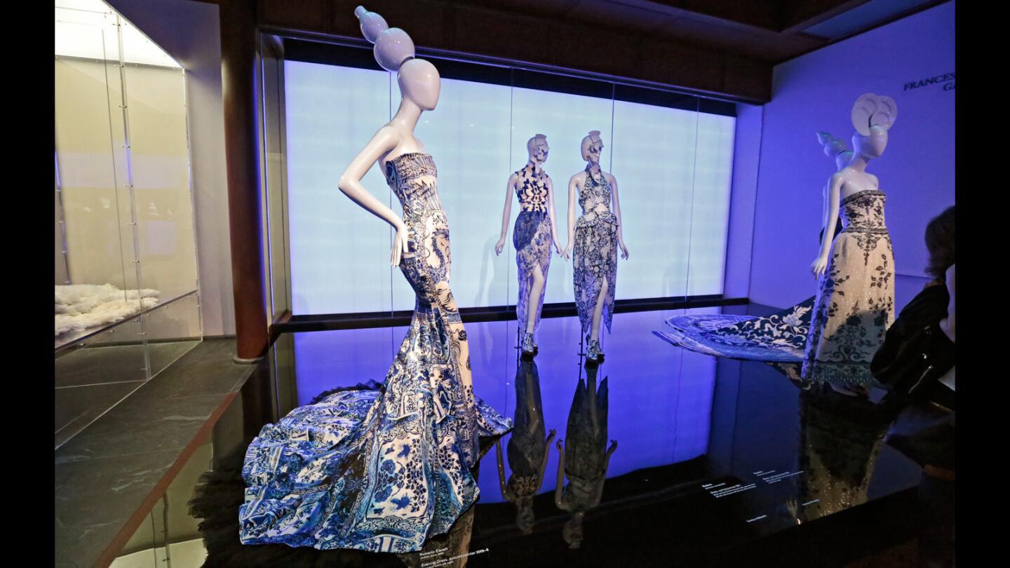 Porcelain-inspired dresses, including an evening dress (left) by Roberta Cavalli that debuted in 2005-06 autumn/winter show. It's on display at "China: Through the Looking Glass."