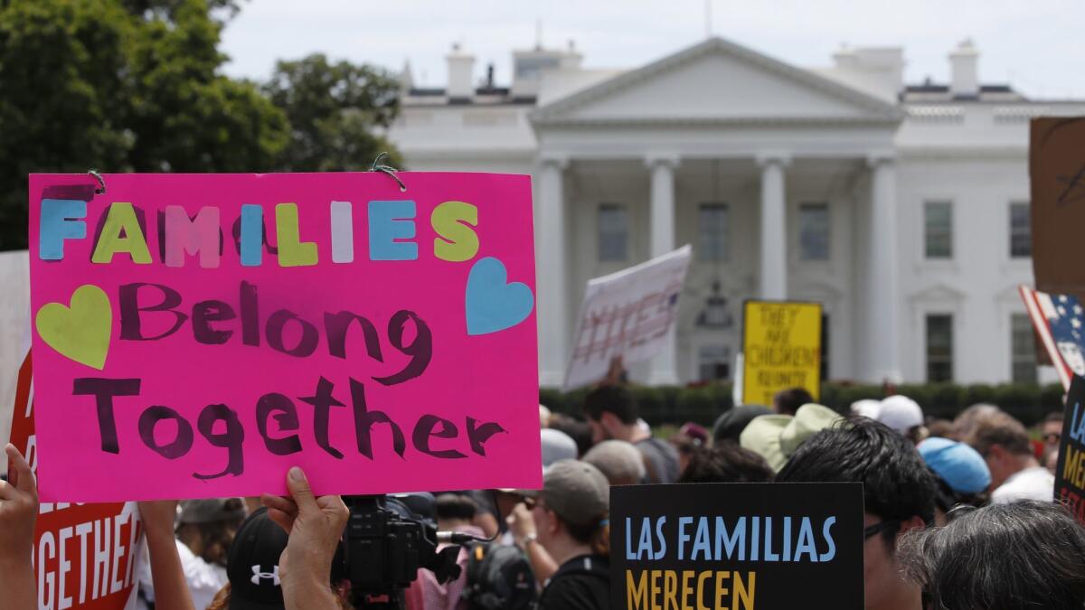 Activists protest the Trump administration's immigration policies at the U.S.-Mexico border in front of the White House on June 20.
