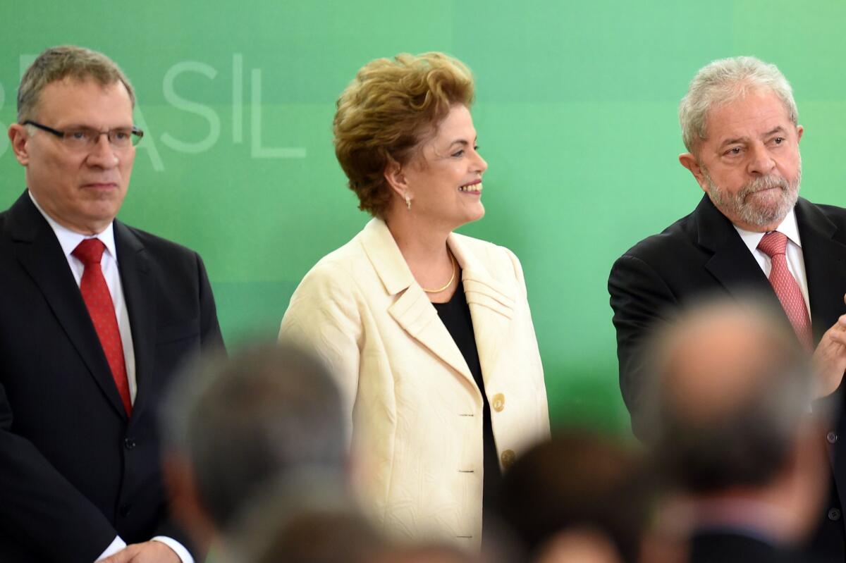 Brazilian President Dilma Rousseff and former president Luiz Inacio Lula da Silva, right, during Thursday's swearing-in ceremony for new Justice Minister Eugenio Arago. (Evaristo Sa / AFP/Getty Images)