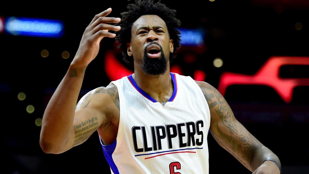 Clippers center DeAndre Jordan reacts after he is called for goaltending during a loss to the Jazz on Wednesday.