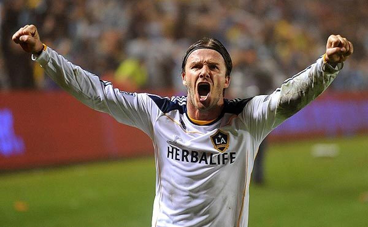 Galaxy midfielder David Beckham celebrates as time expires.This is the Galaxy's third MLS championship and the first since 2005. It's also Beckham's first title in L.A.