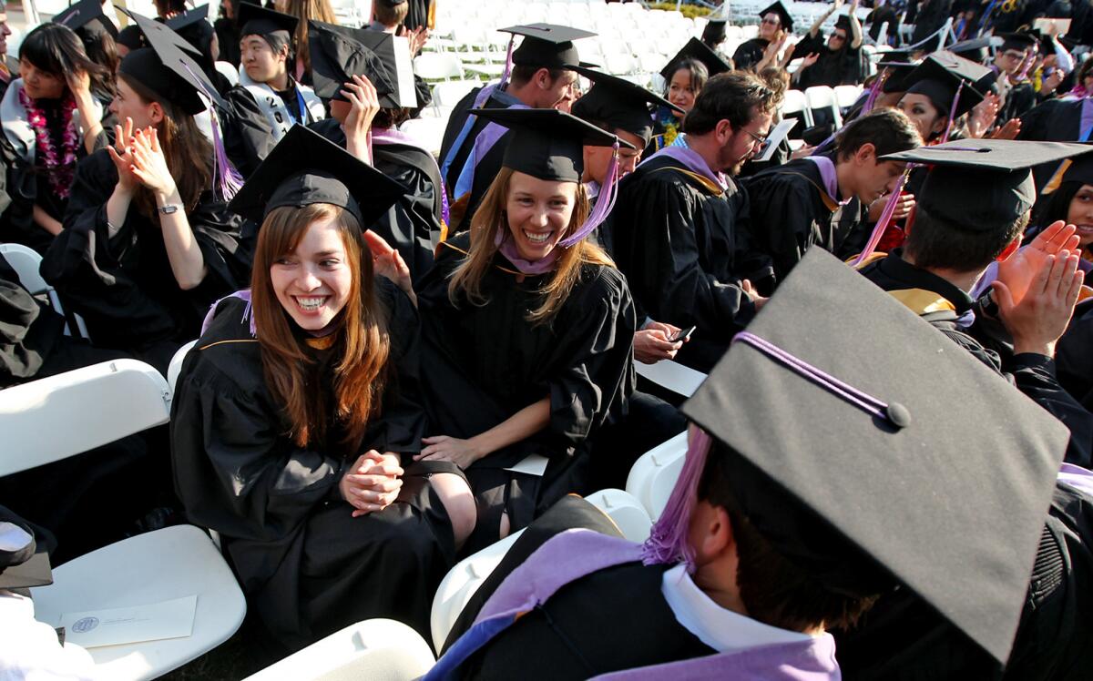 Maria Gomez, 26, left, graduates from UCLA with her master's degree in architecture.