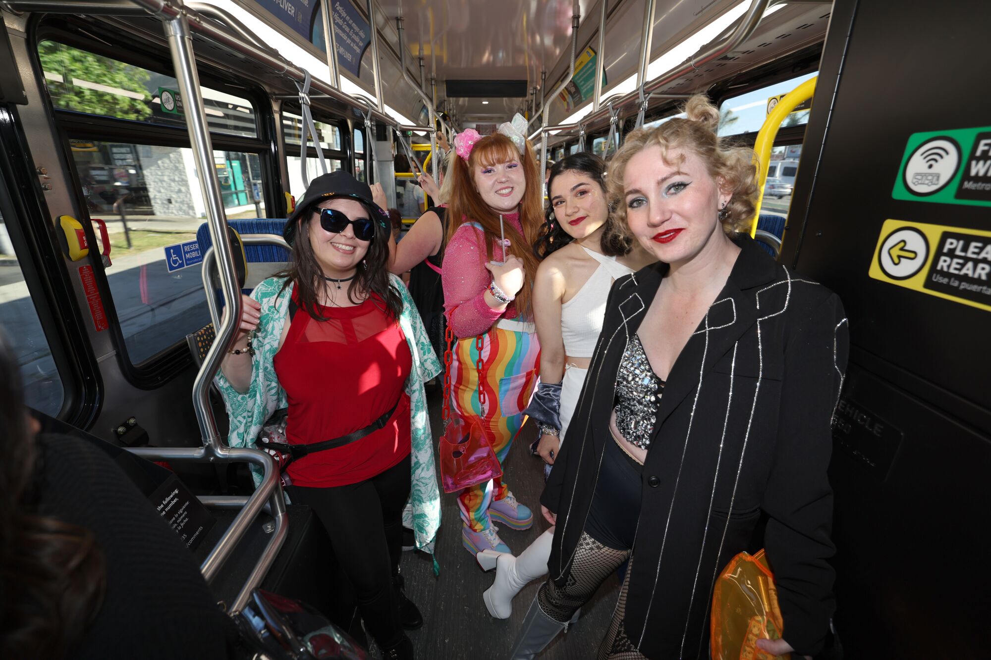 A bus load of Swifties ride a free shuttle bus to SoFi stadium to see Taylor Swift.