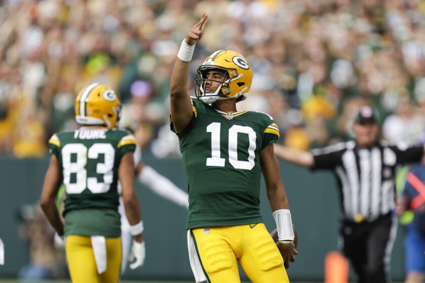 Green Bay Packers quarterback Jordan Love (10) reacts after carrying for a first down during the second half of an NFL football game against the New Orleans Saints Sunday, Sept. 24, 2023, in Green Bay, Wis. (AP Photo/Matt Ludtke)