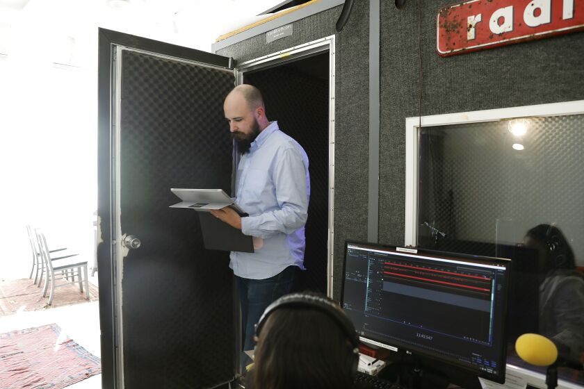 LOS ANGELES-CA-OCTOBER 23, 2018: Jesse Thorn, co-host and co-executive director of podcasting production company Maximum Fun, exits the recording booth at their office in Los Angeles on Tuesday, October 23, 2018. (Christina House / Los Angeles Times)