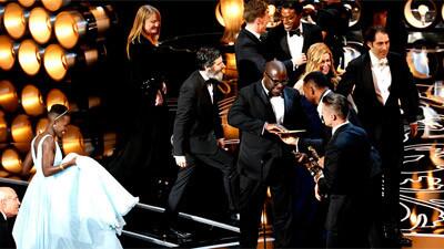 Best Picture "12 Years a Slave" director Steve McQueen celebrates with his cast.