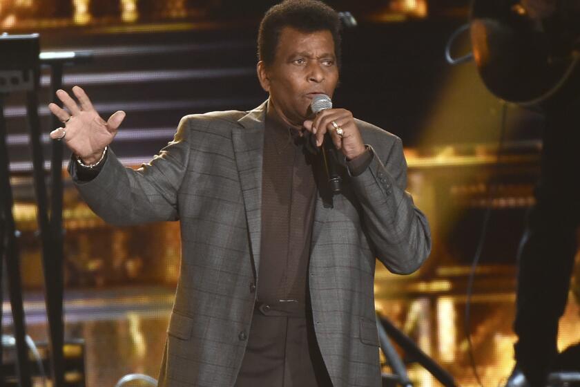 FILE - Charley Pride performs "Kiss An Angel Good Morning" at the 50th annual CMA Awards in Nashville, Tenn. on Nov. 3, 2016. Pride will get a lifetime achievement award at the CMA Awards in November. (Photo by Charles Sykes/Invision/AP, File)