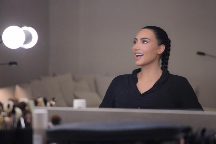 Kim Kardashian smiles