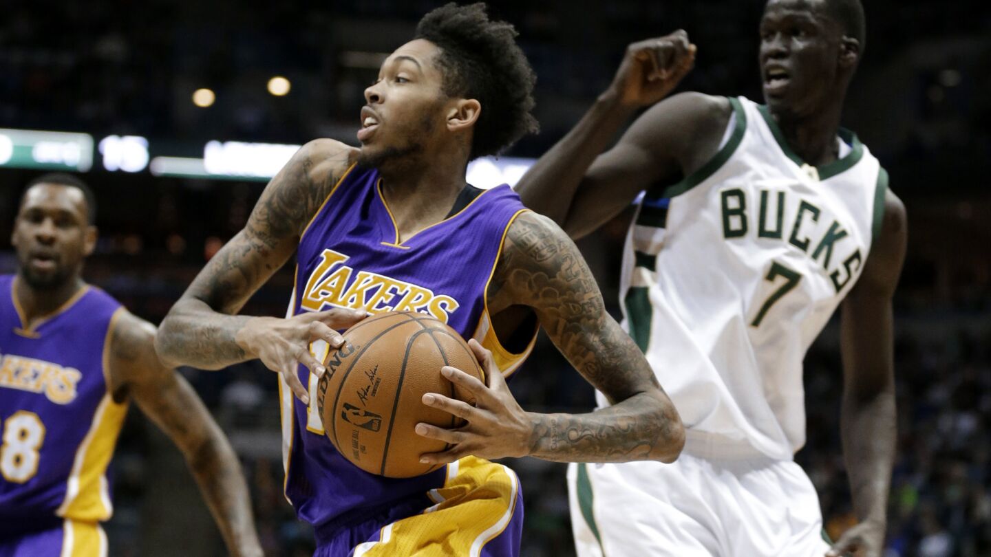 Lakers forward Brandon Ingram drives the baseline past Bucks center Thon Maker during the first half.