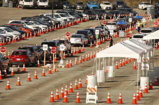California's coronavirus case rate now the lowest in the
continental U.S. 4 LOS ANGELES, CA - FEBRUARY 25: Vehicles wind their way through the parking lots at Los Angeles Dodger Stadium for COVID-19 vaccinations which is one of the largest vaccination sites in the country. It is one of five city-run vaccination sites working in partnership with actor Sean Penn's nonprofit Core (Community Organized Relief Effort). Vehicles arriving off of Academy Road are directed to one of three different areas where the vaccine is being administered to people in their vehicles. Dodger Stadium on Thursday, Feb. 25, 2021 in Los Angeles, CA. (Al Seib / Los Angeles Times).