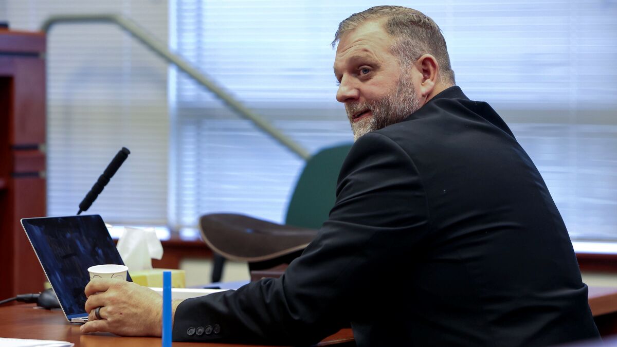 FILE - Ammon Bundy glances toward the prosecution table during a pause in his trial to clarify a line of questioning with the jury dismissed in Ada County Magistrate Judge Kim Dale's courtroom Tuesday, March 15, 2022, in Boise, Idaho. An Idaho hospital that went on lockdown in March after far-right activists protested outside is suing Bundy, Diego Rodriguez and their various political organizations for defamation and “sustained online attacks." St. Luke’s Health System filed the lawsuit Wednesday, May 11 against Bundy, his gubernatorial campaign, and the People’s Rights Network organization. (Darin Oswald/Idaho Statesman via AP, File)