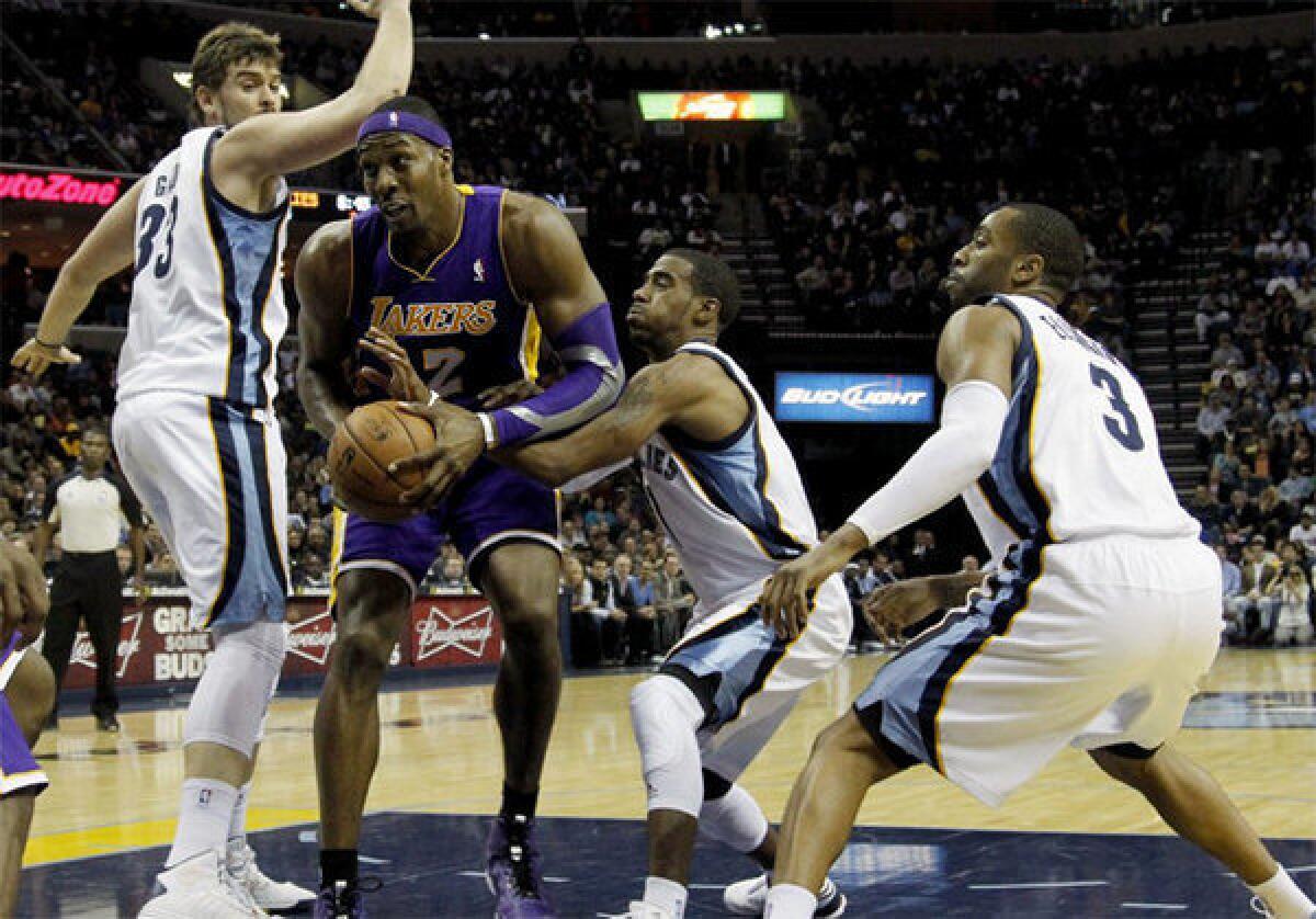 Dwight Howard powers through the Grizzlies' Mike Conley and Marc Gasol