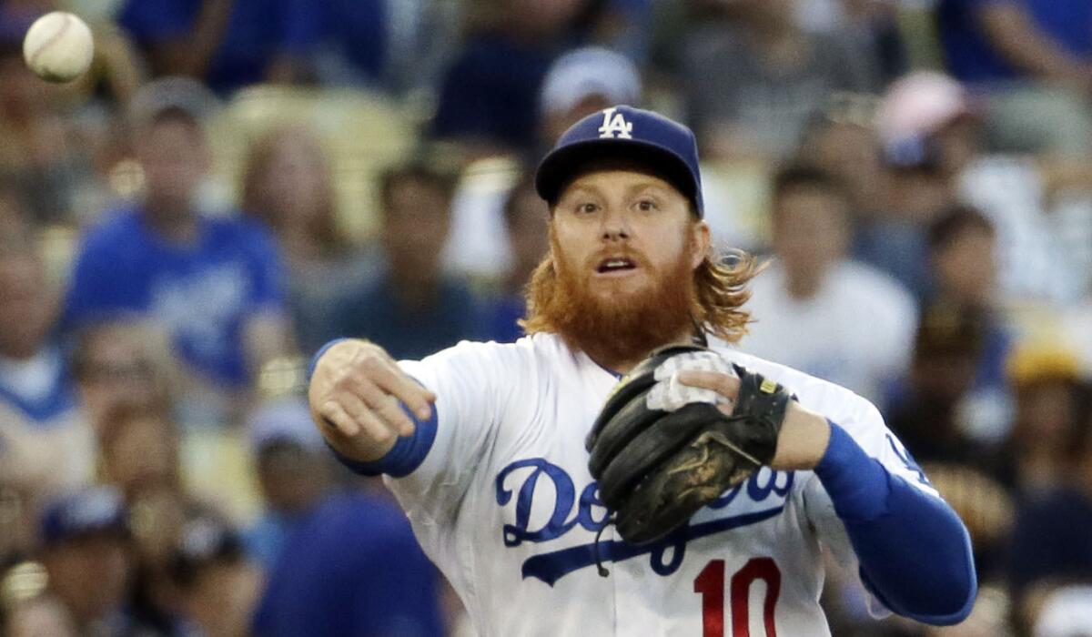 Dodgers third baseman Justin Turner throws to first against Pittsburgh on Saturday night.