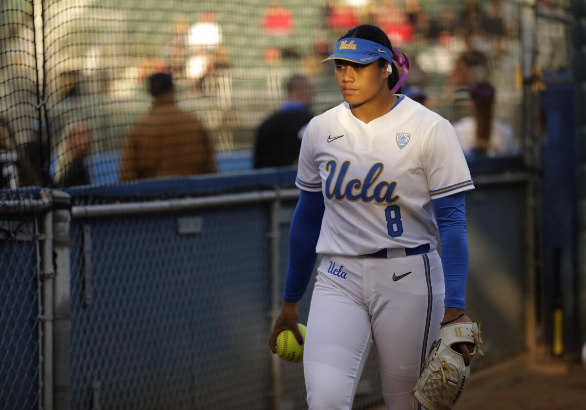 UCLA's Megan Faraimo warms up in the bullpen before a game against Utah.