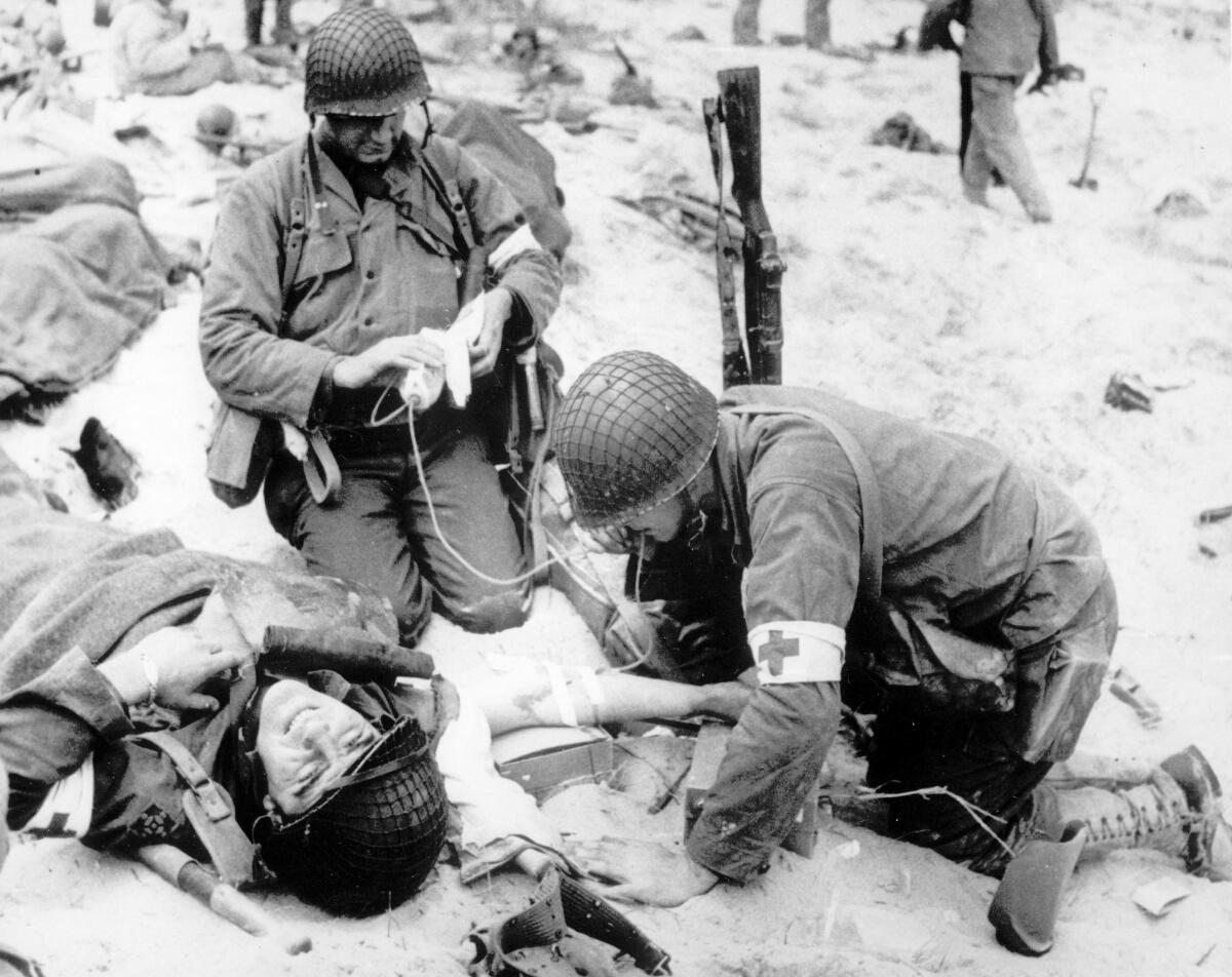U.S. Army medics treat a wounded soldier 