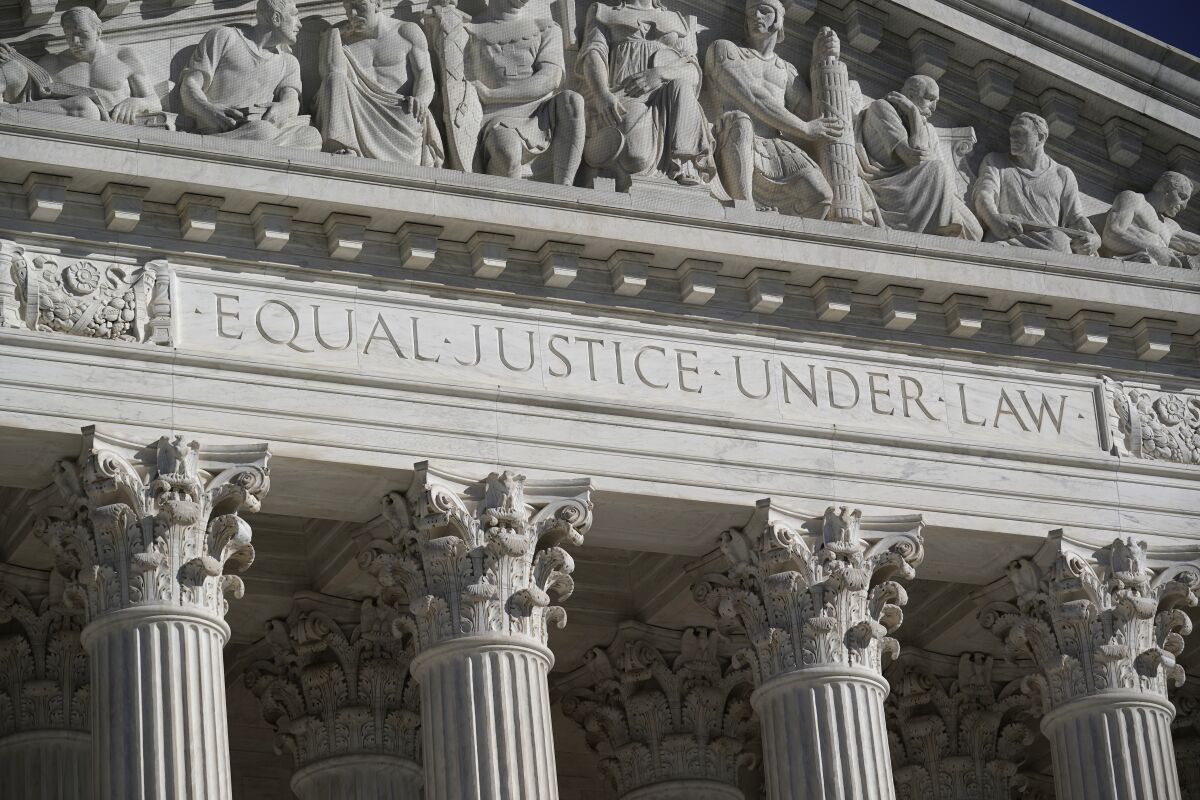 The words "equal justice under law" inscribed on the frieze of the Supreme Court building. 